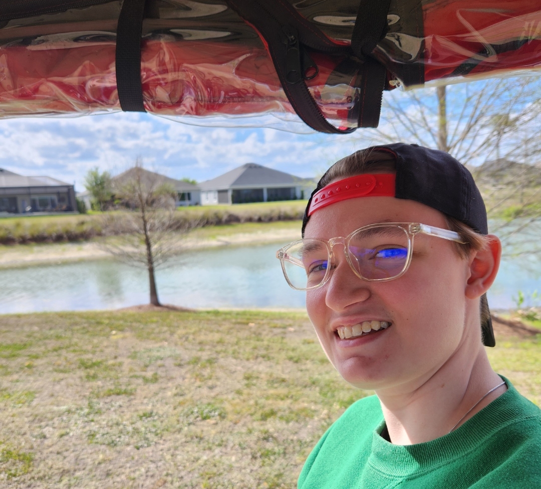 2023-03-17 Cate with golf couse gator.jpg